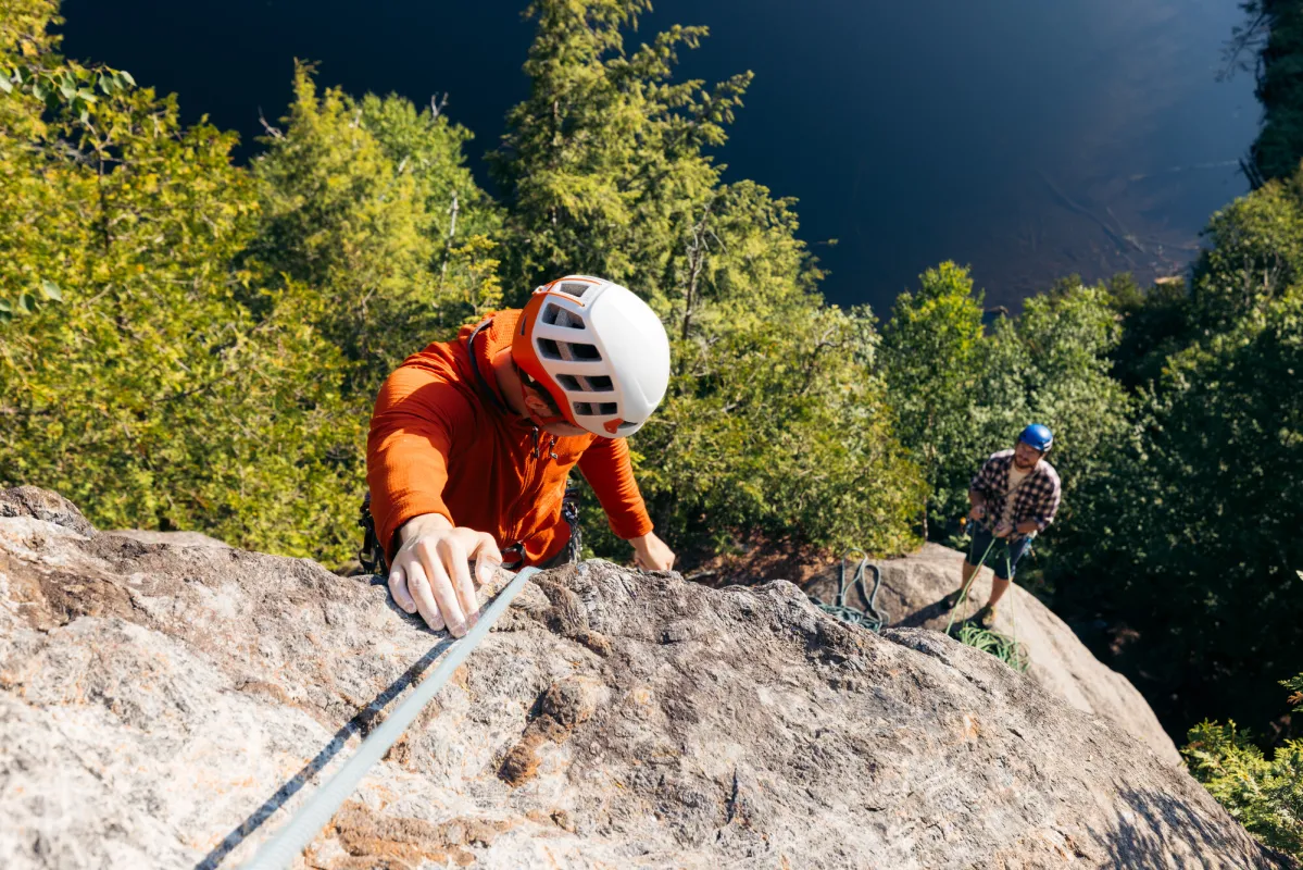 Two climbers on a multi-pitch above Chapel Pond.