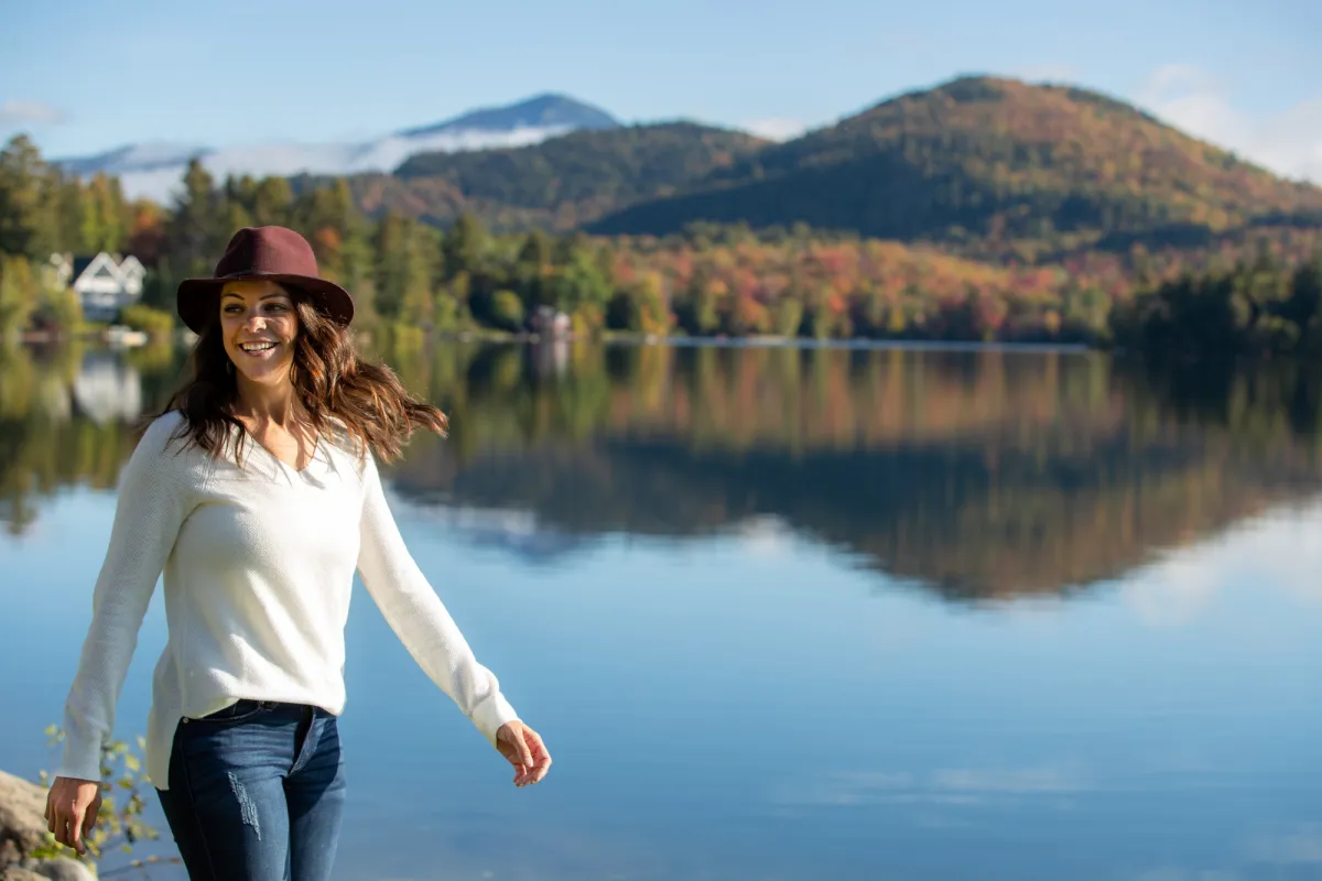 Person Walking Near Lake