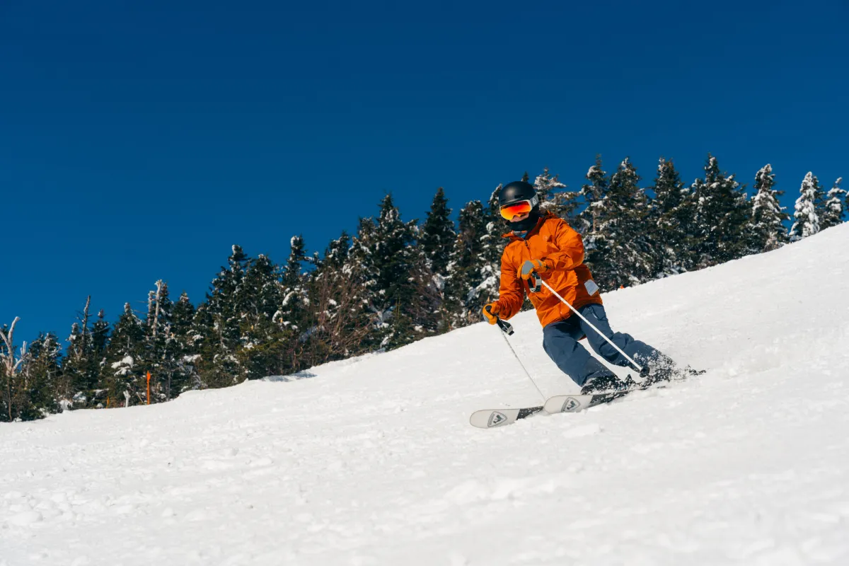 A person skiing down a mountain.