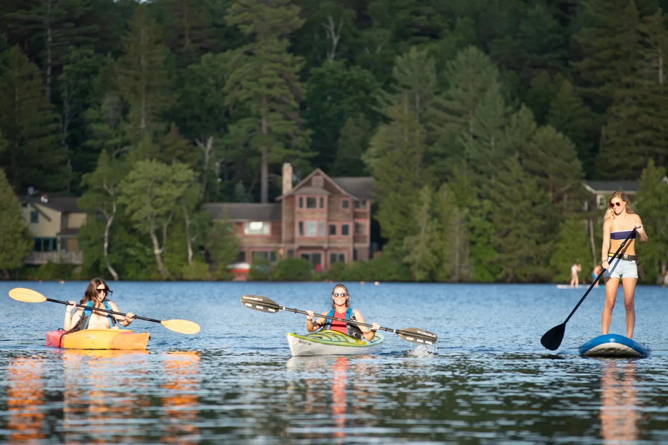 Three people paddling on Mirror Lake.