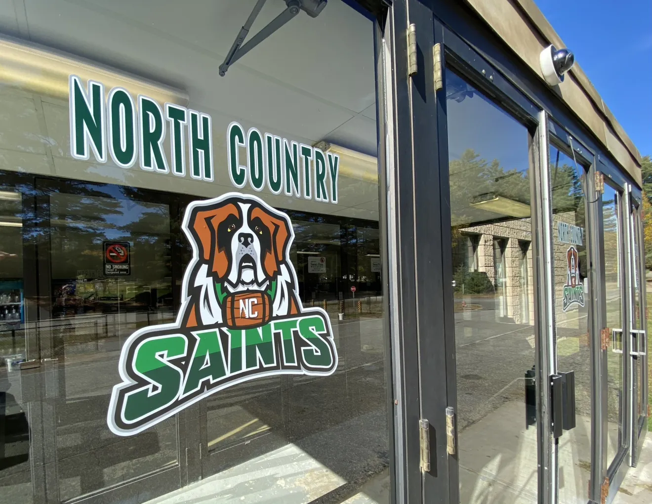 An image of a Saint Bernard dog logo for a community college on a window. 