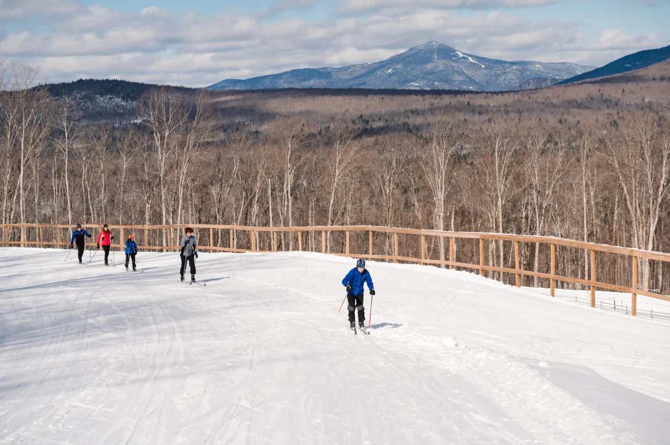 A family skis at a xc ski center
