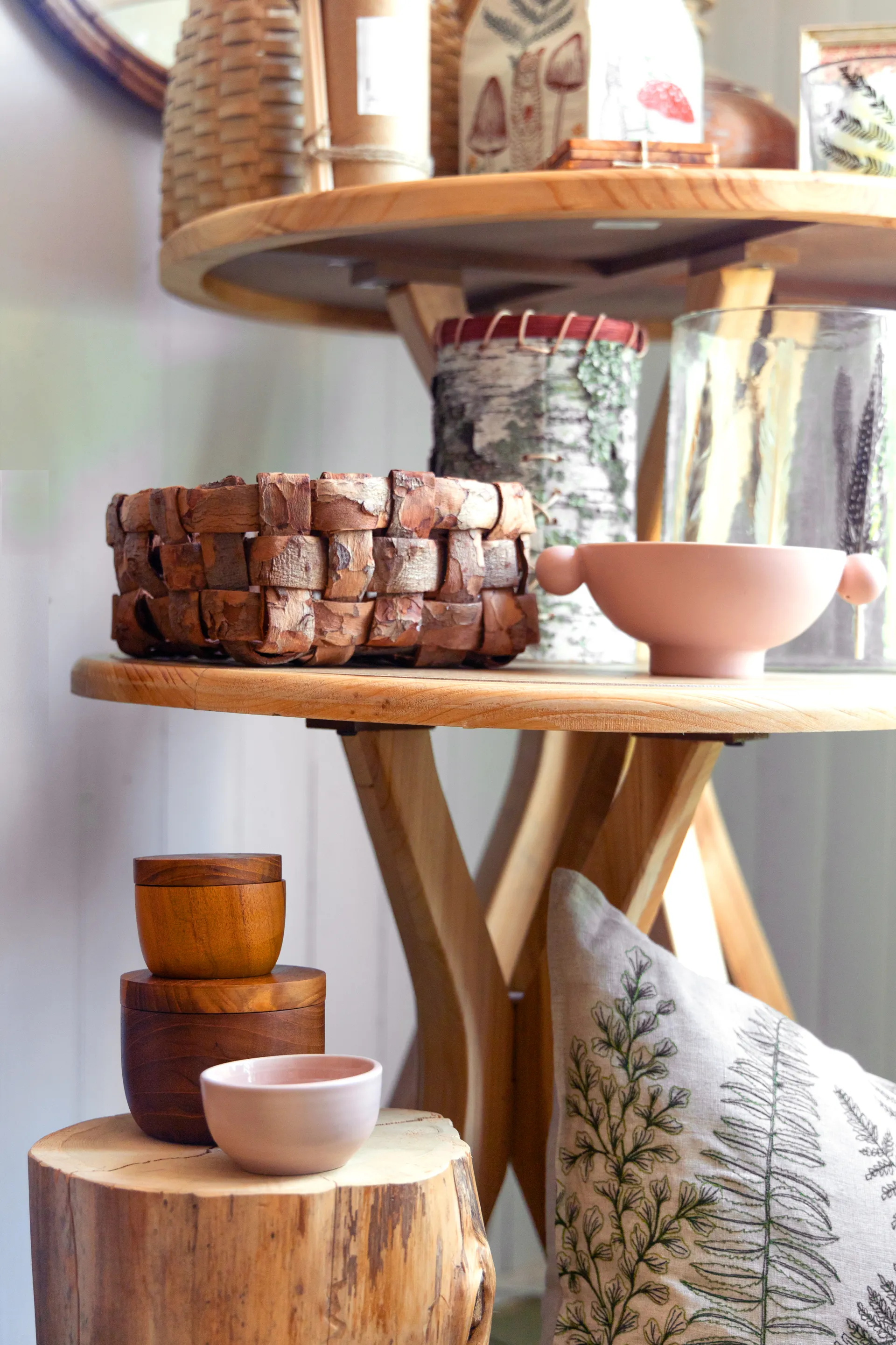 Rustic decor like wooden bowls and woven bark baskets