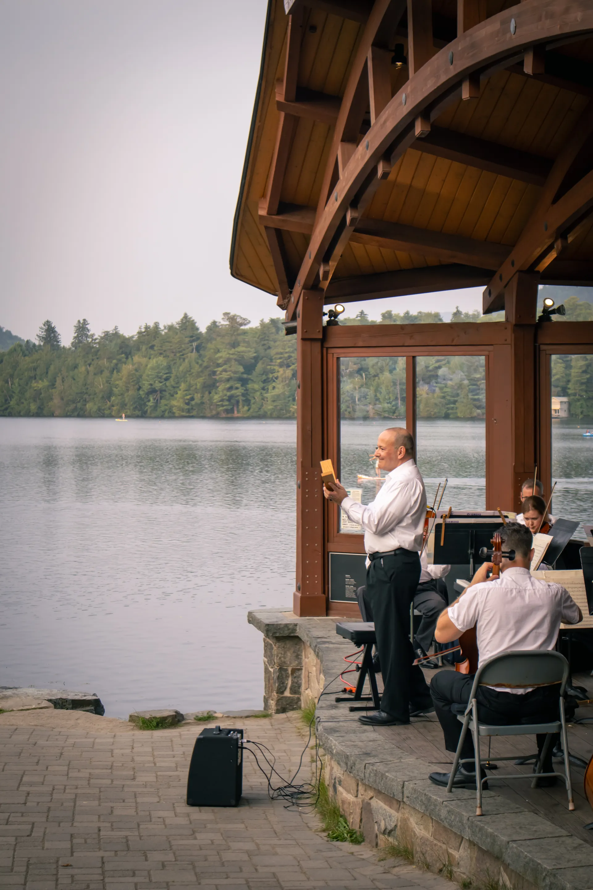 Conductor from within the orchestral shell overlooking Mirror Lake Credit to: Jacob Rushlow