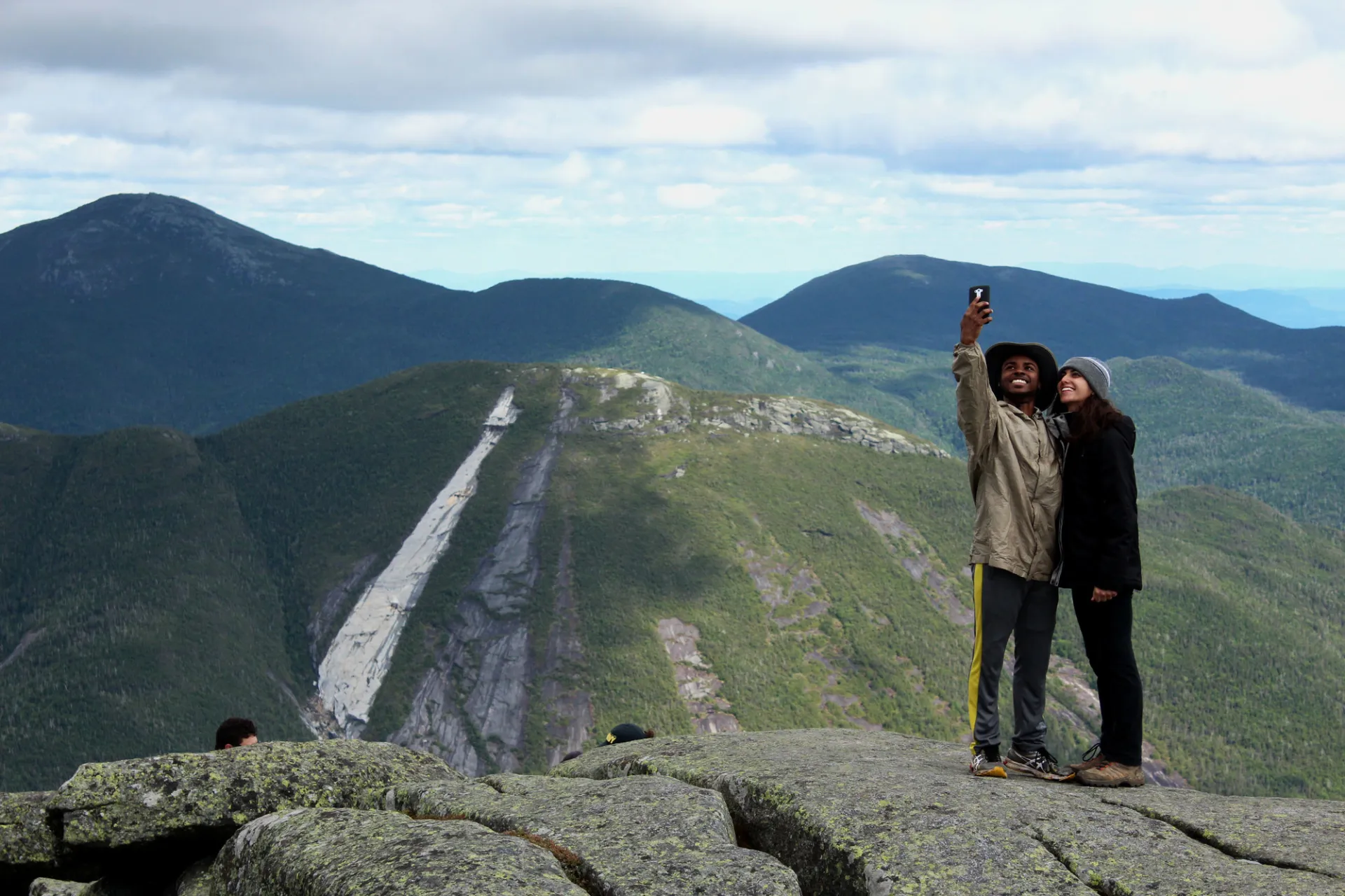 Two people standing on Algonquin Peak taking a selfie
