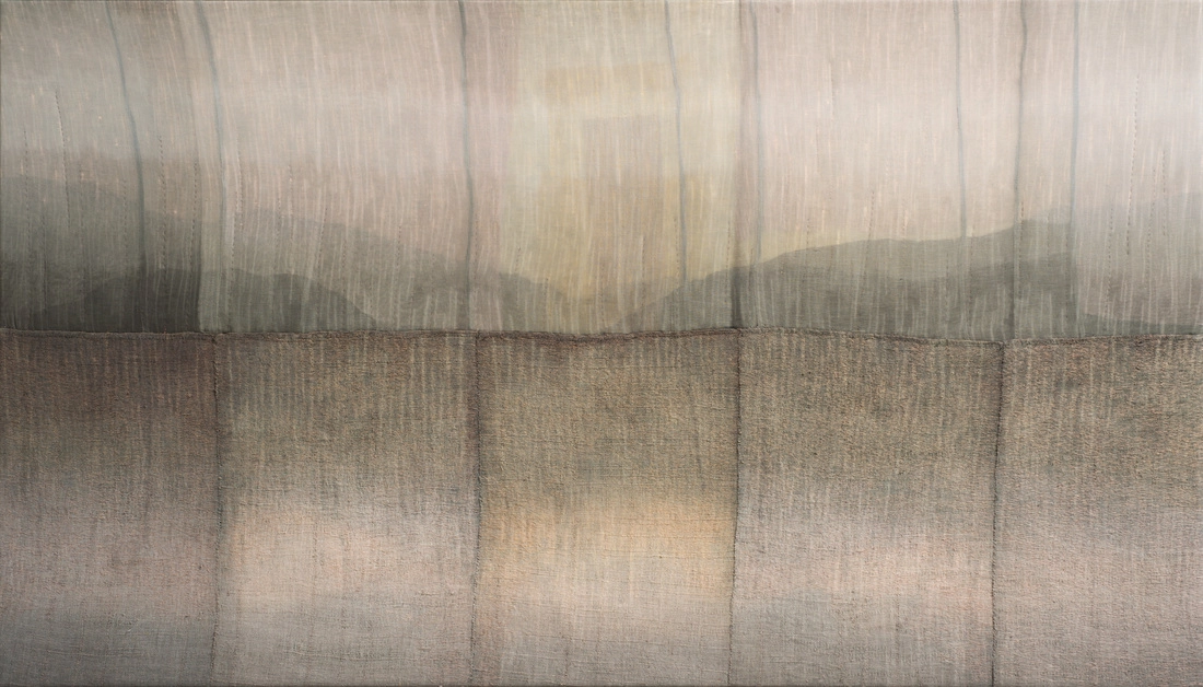 Art piece of unknown material pieces that appears to have a mountainous watercolor design