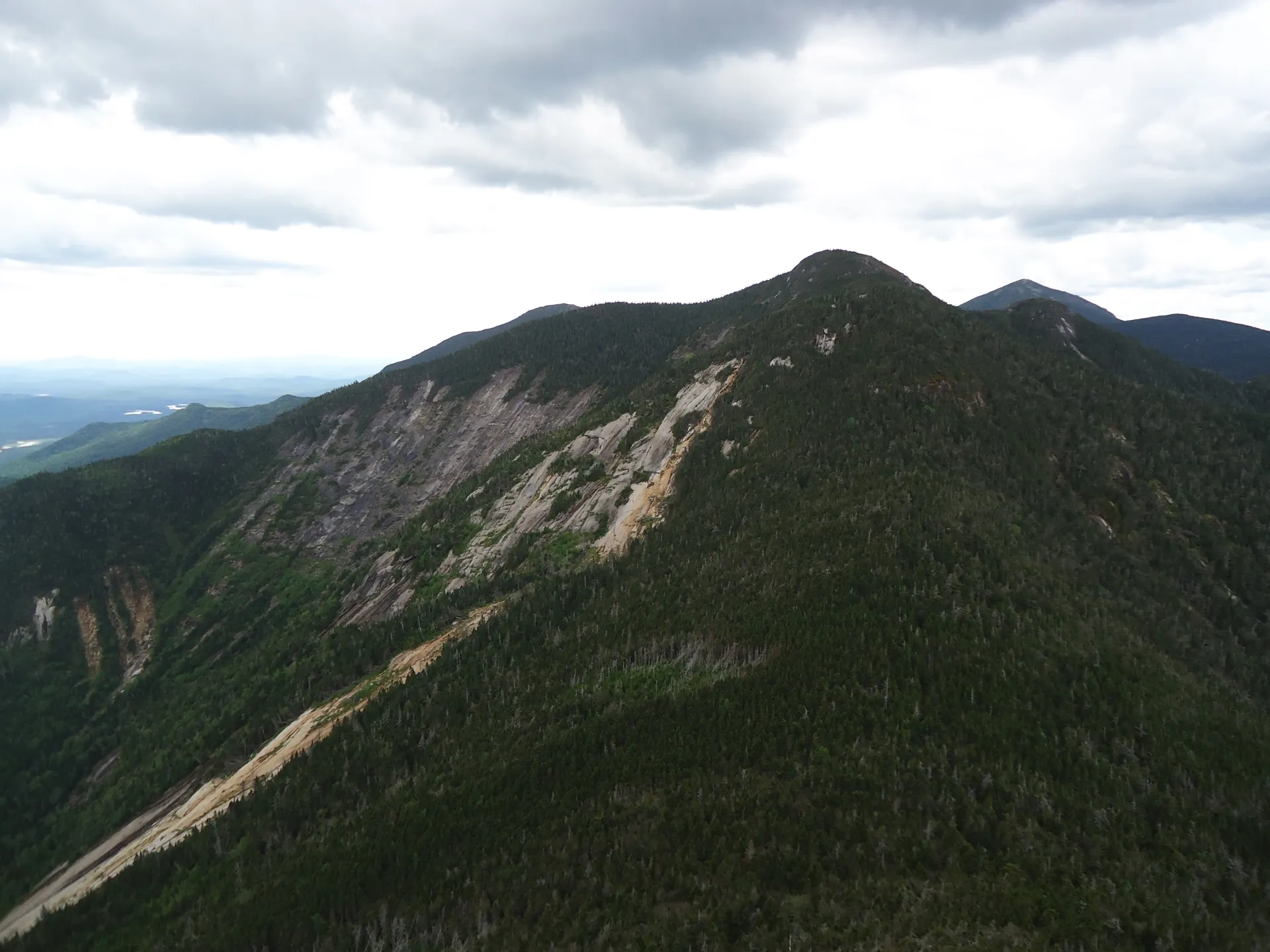 View of a tall mountain with rock slides