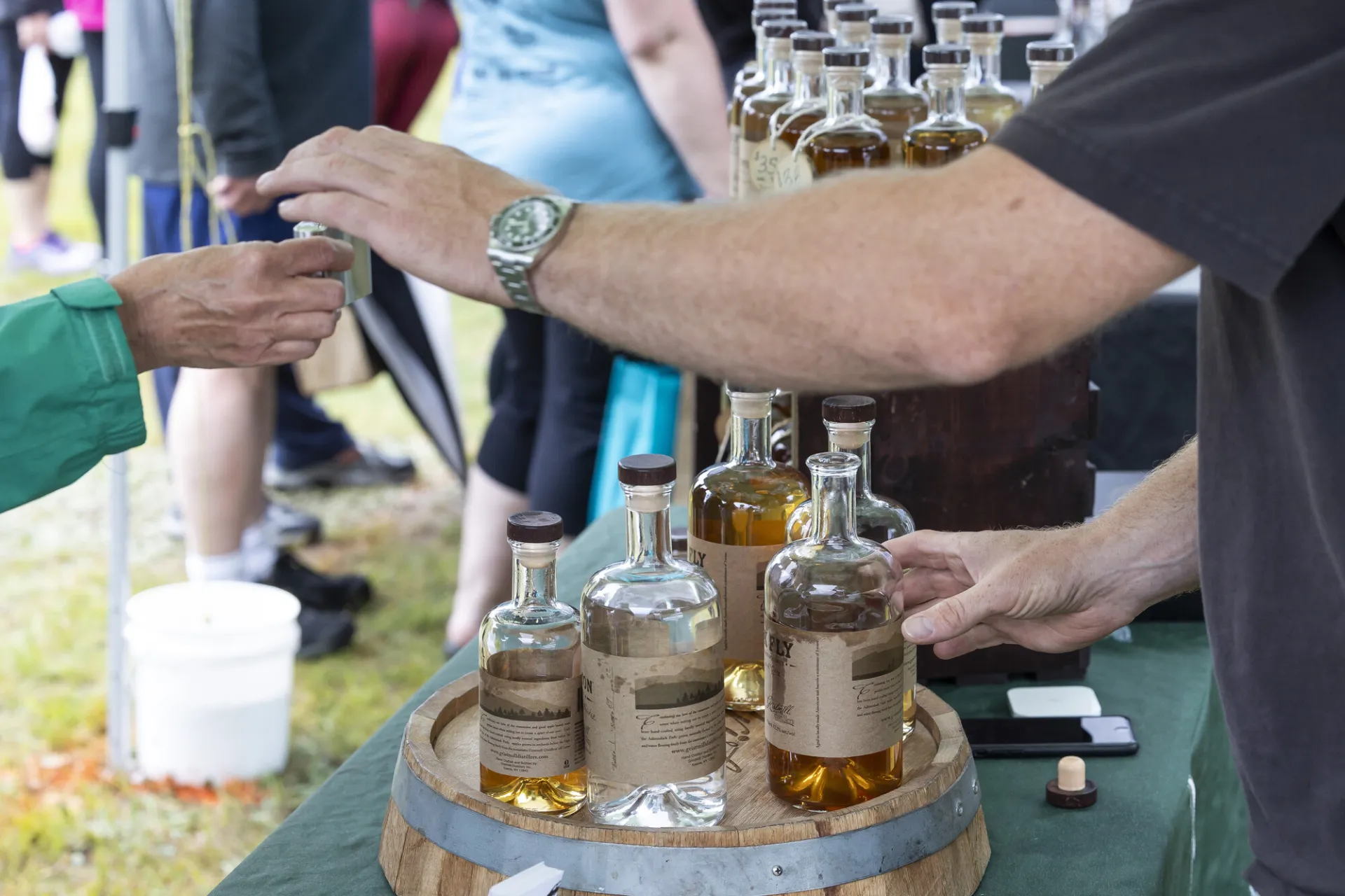 Vendor pours whiskey sample