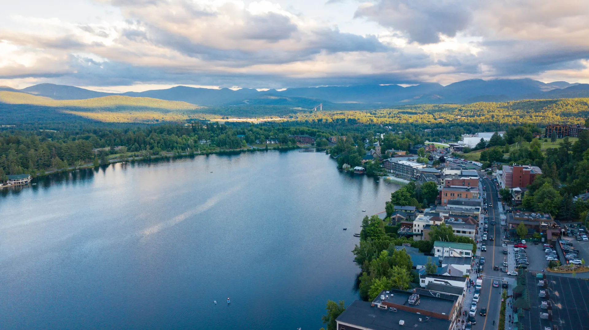 Aerial view of Mirror Lake and Main Street, Lake Placid in summer at sunset