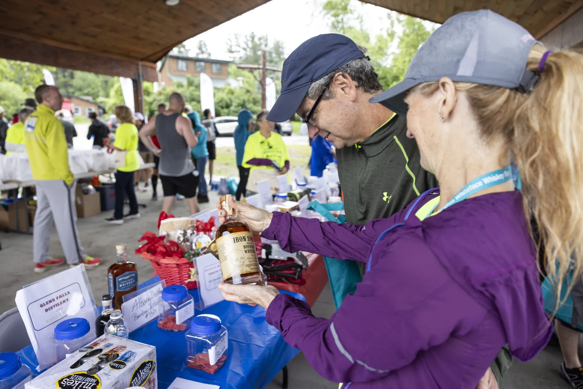 Racers look at whiskey raffle baskets