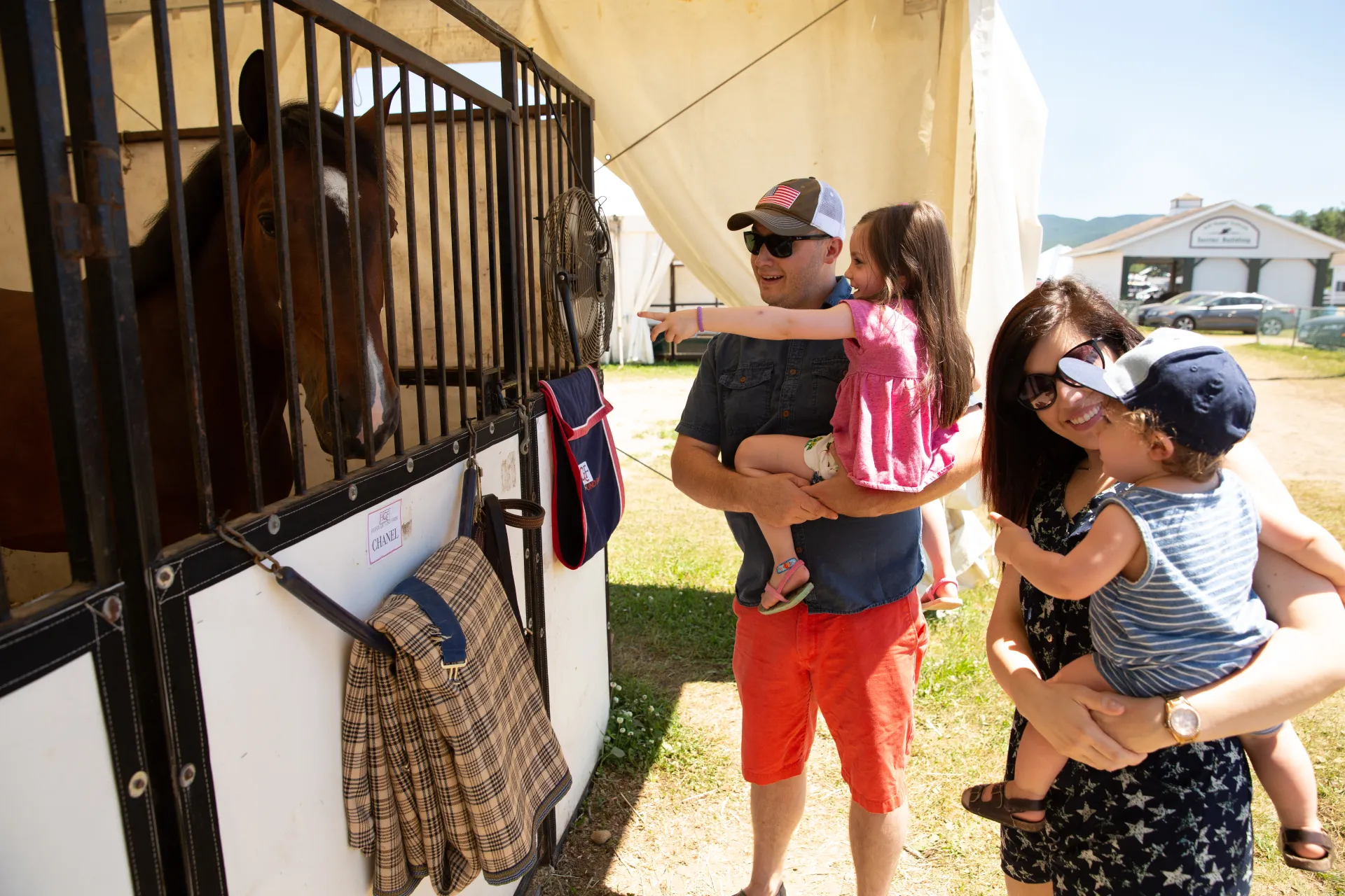 Family visits the horses at the Lake Placid Horse Show
