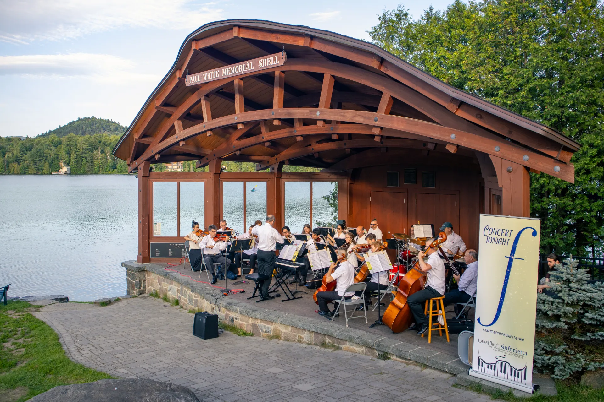 Orchestra in the park shell with Mirror Lake background Credit to: Jacob Rushlow