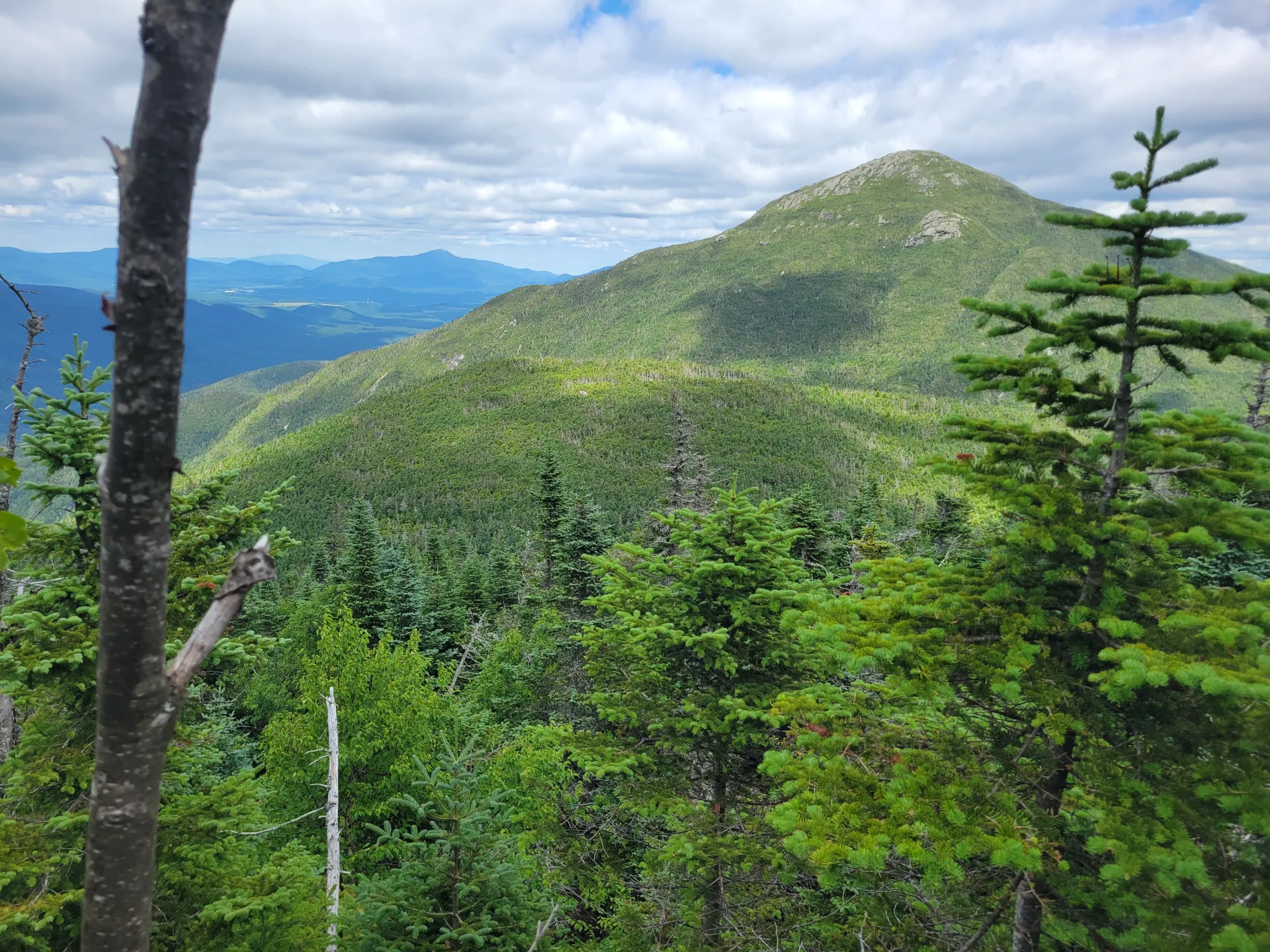 A tall mountain seen from another mountain