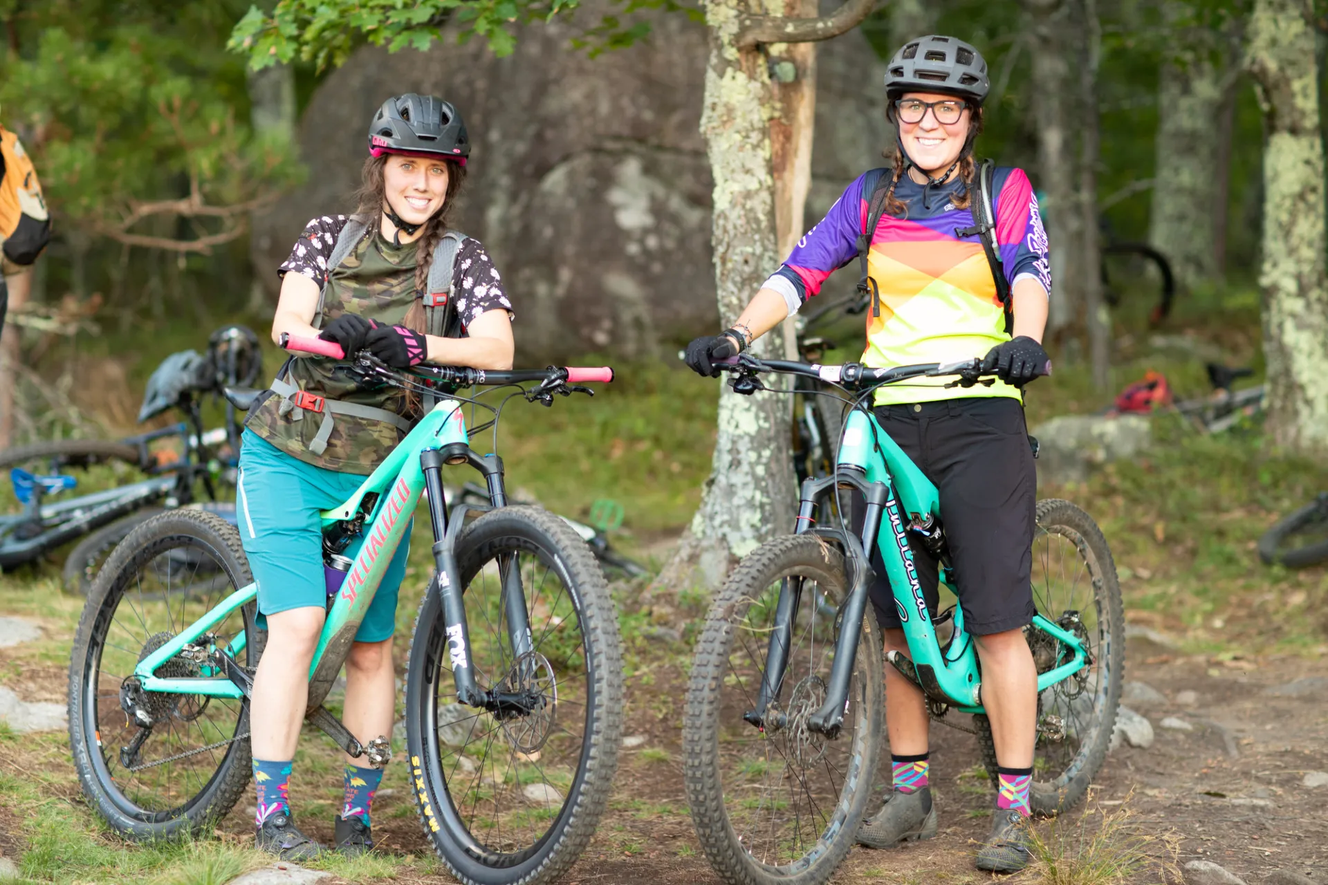 Smiling faces on matching teal bikes