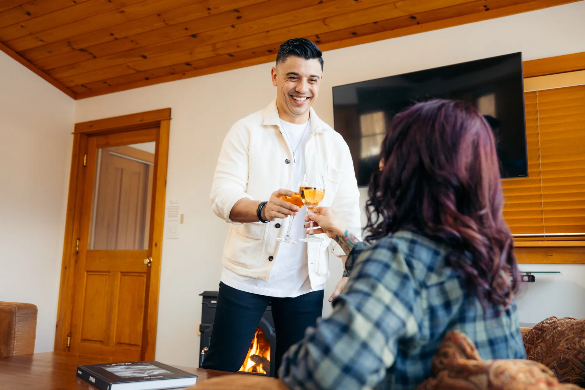  Lounging by the fire with a good beverage and great company at the Algonquin Mountain Chalet.