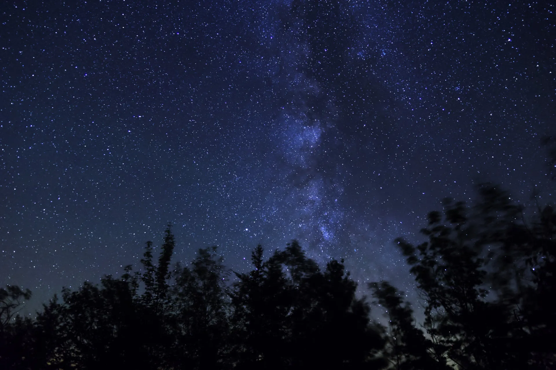 A dark, starry night sky.