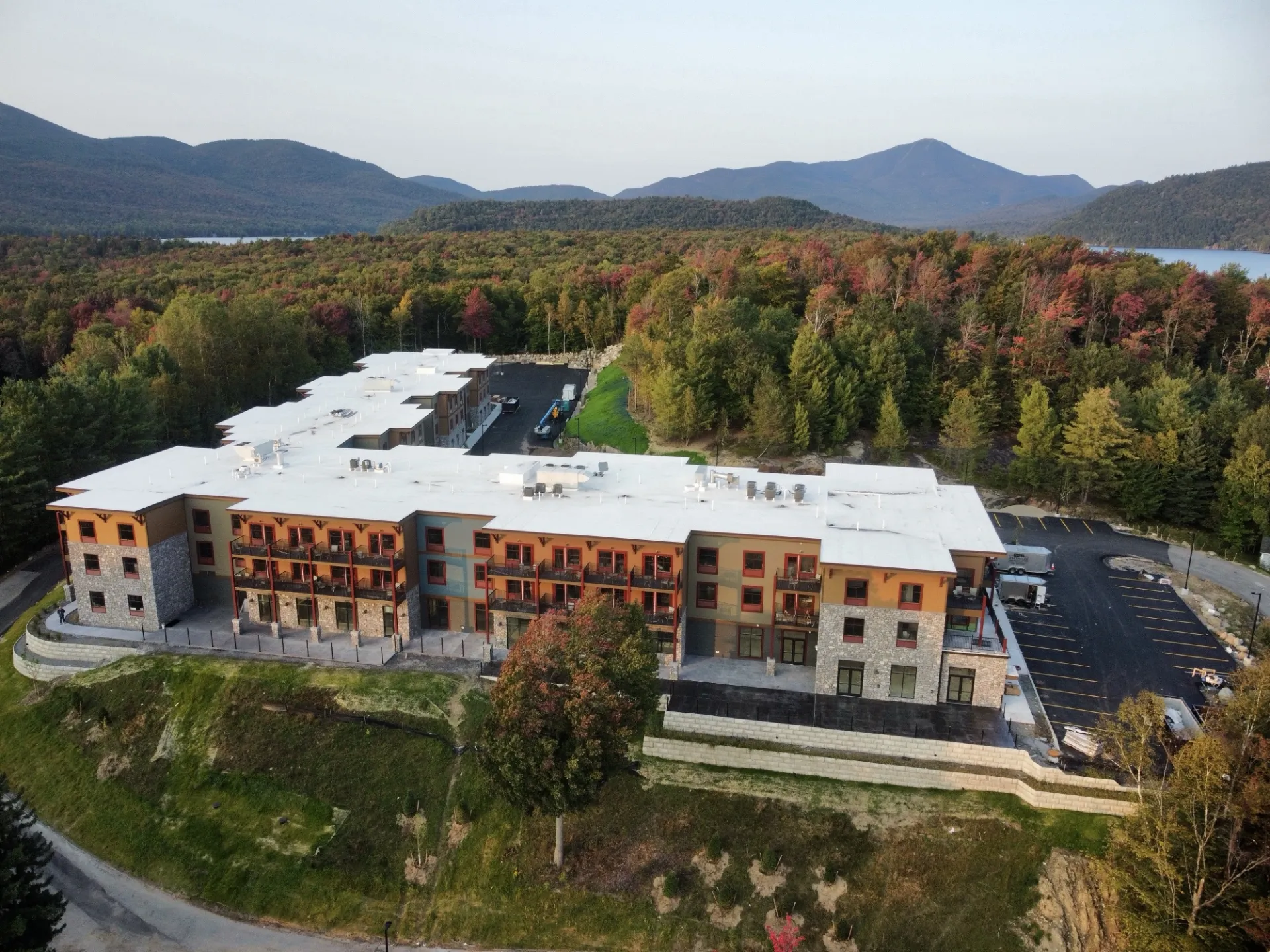 Aerial View of the Cambria Hotel in the fall displaying beautiful foliage and the surrounding mountains.