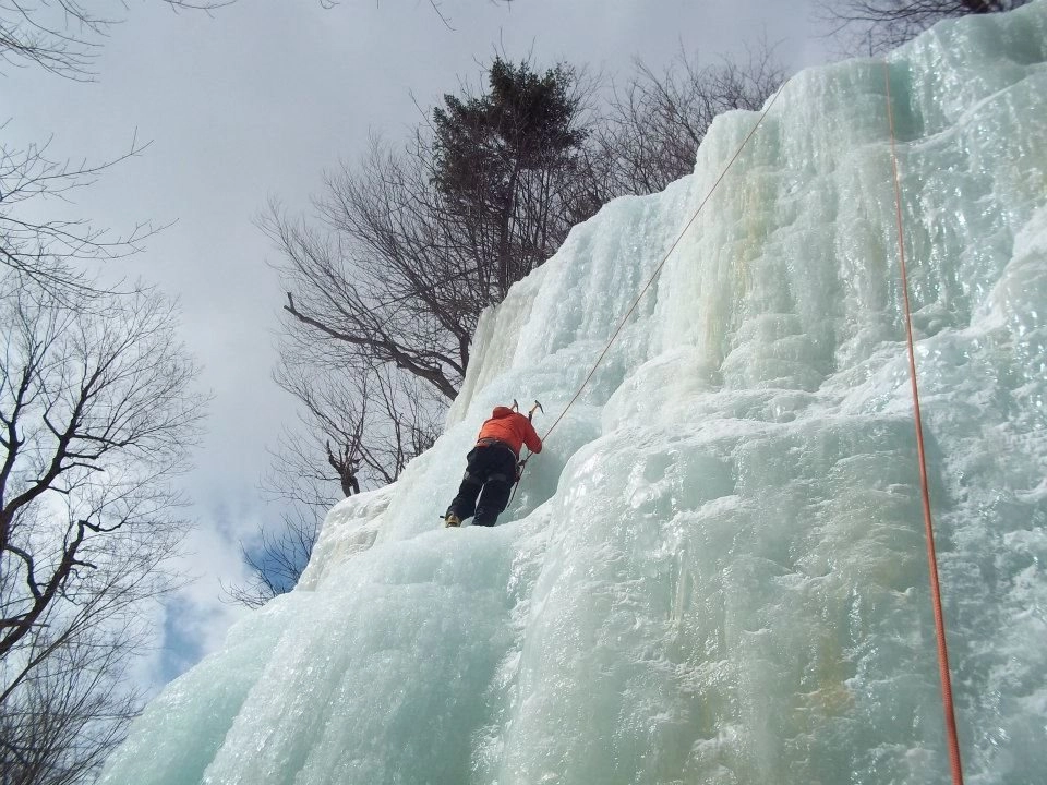 An ice climber on top rope