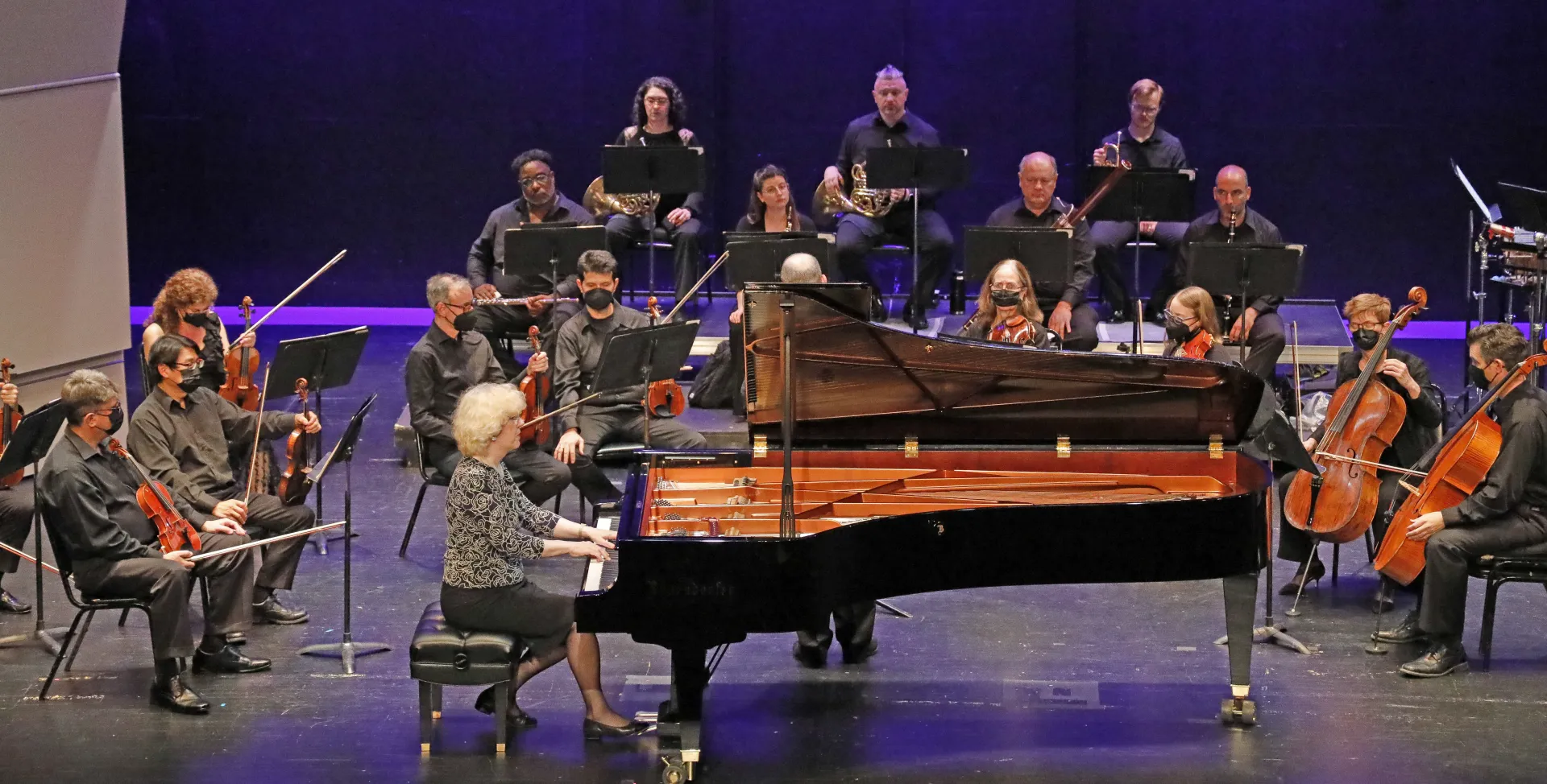Grand Piano surrounded by orchestra