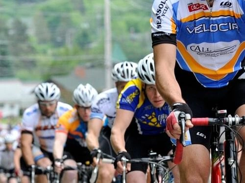 Cyclers pedal forward with intensity