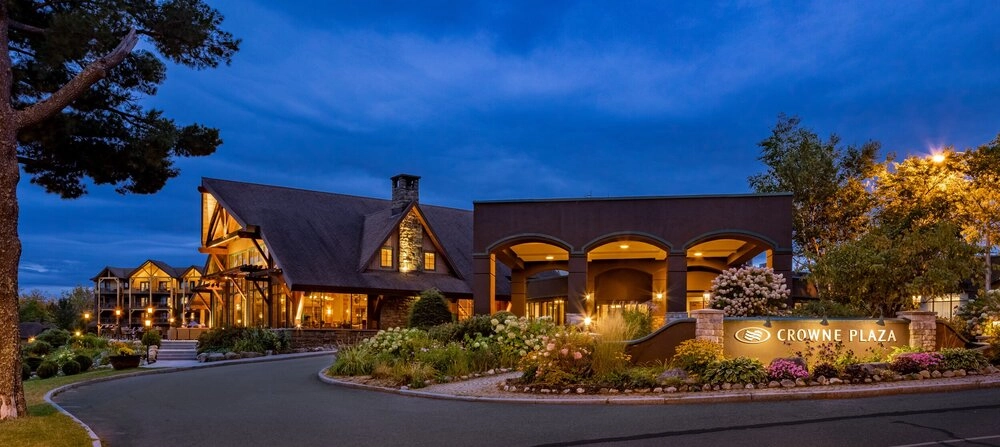 The illuminated front entryway of Lake Placid Club Grandview at dusk