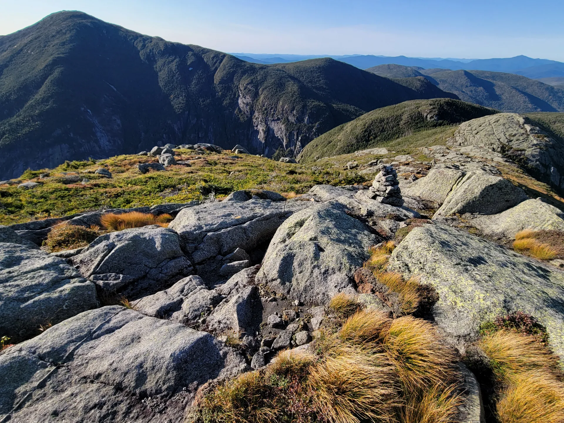 A view from a rocky summit into a deep gorge