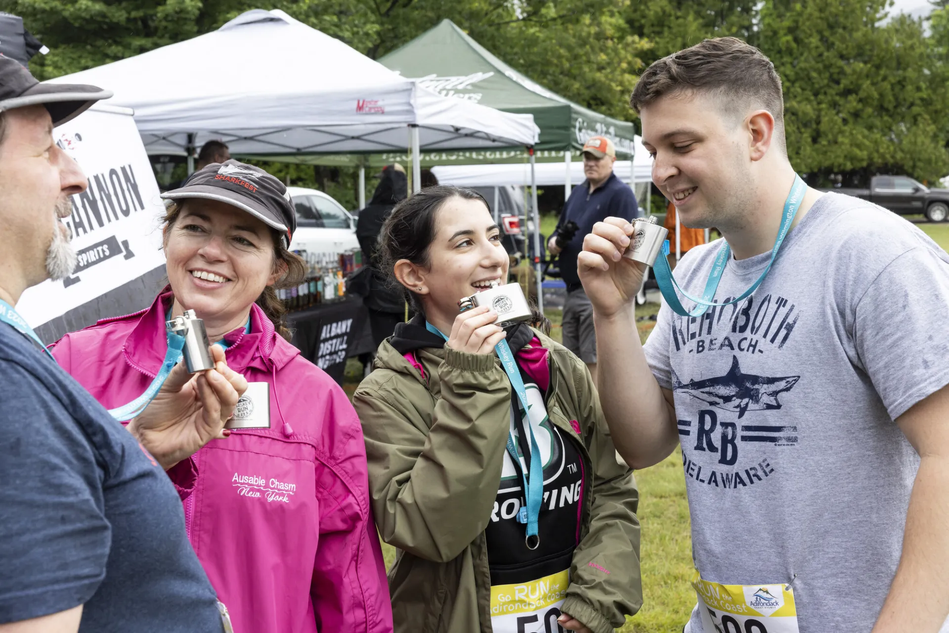 Racers sip from Whiskey Run flask medals
