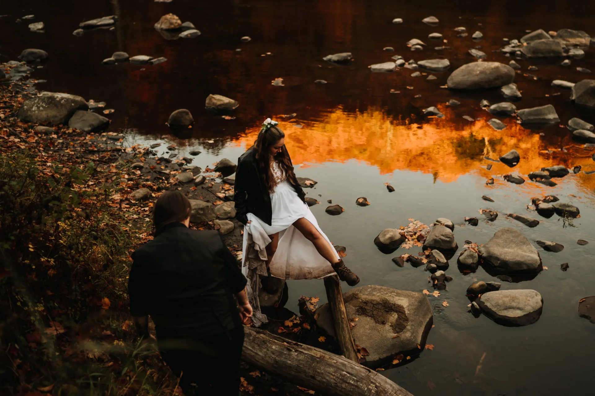 married couple hanging out at a stream