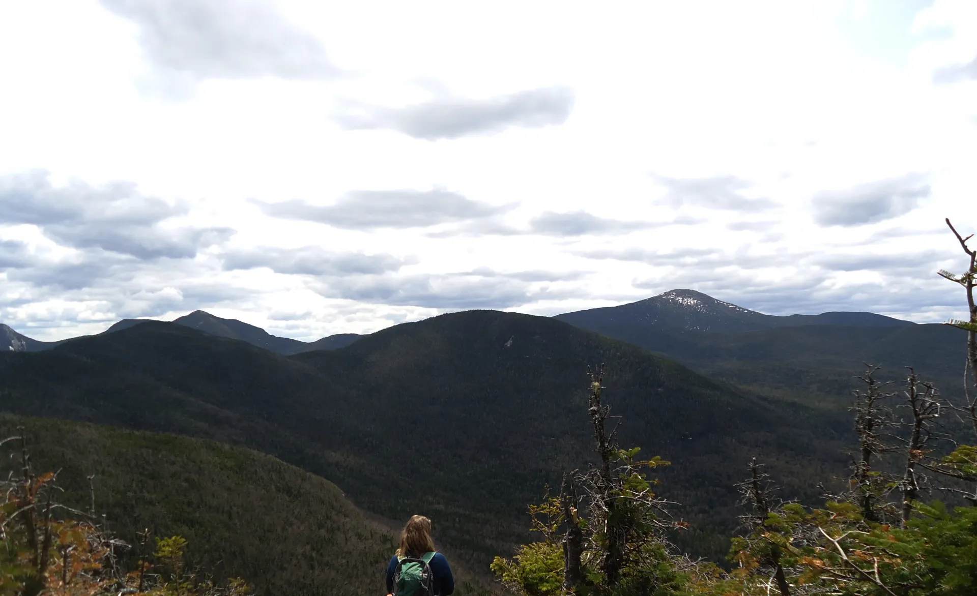 A hiker on a mountain top