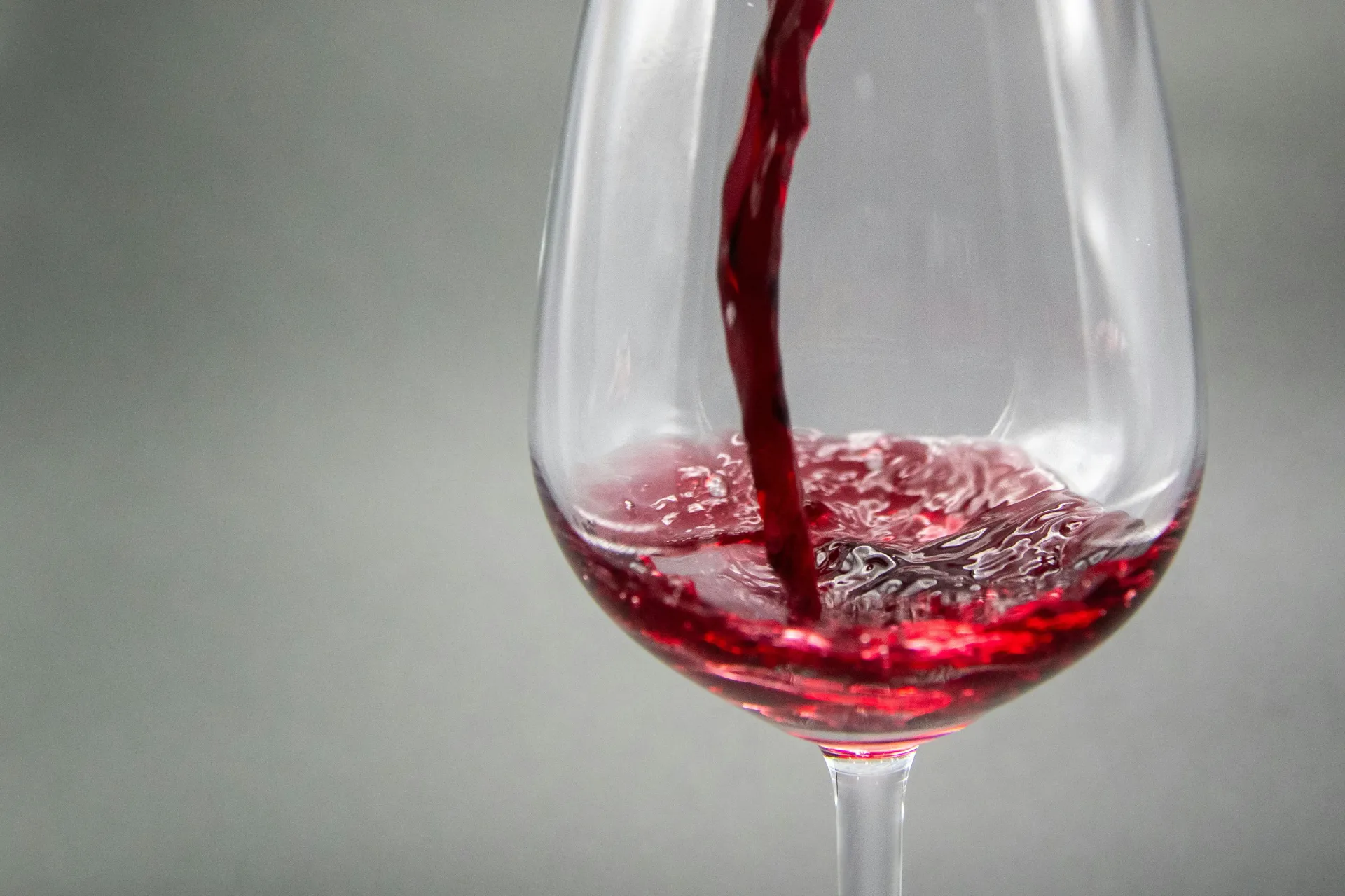 Red wine being poured into a glass