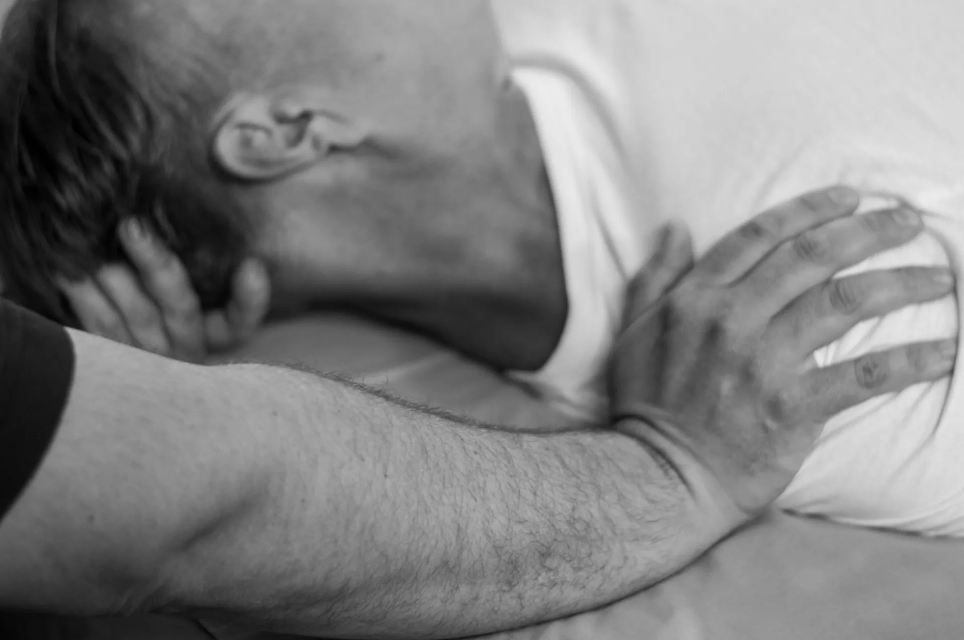 A massage therapist applies pressure to a shoulder to properly stretch the trap muscle during a massage at Healing Elements.