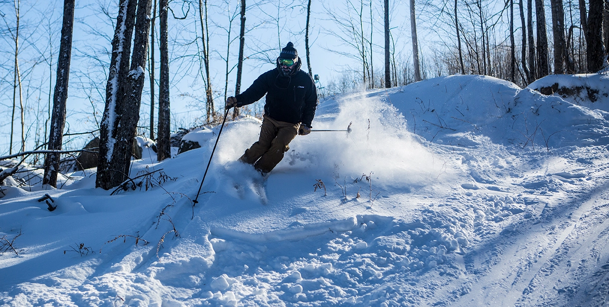 A skier doing side hits on Mt Pisgah