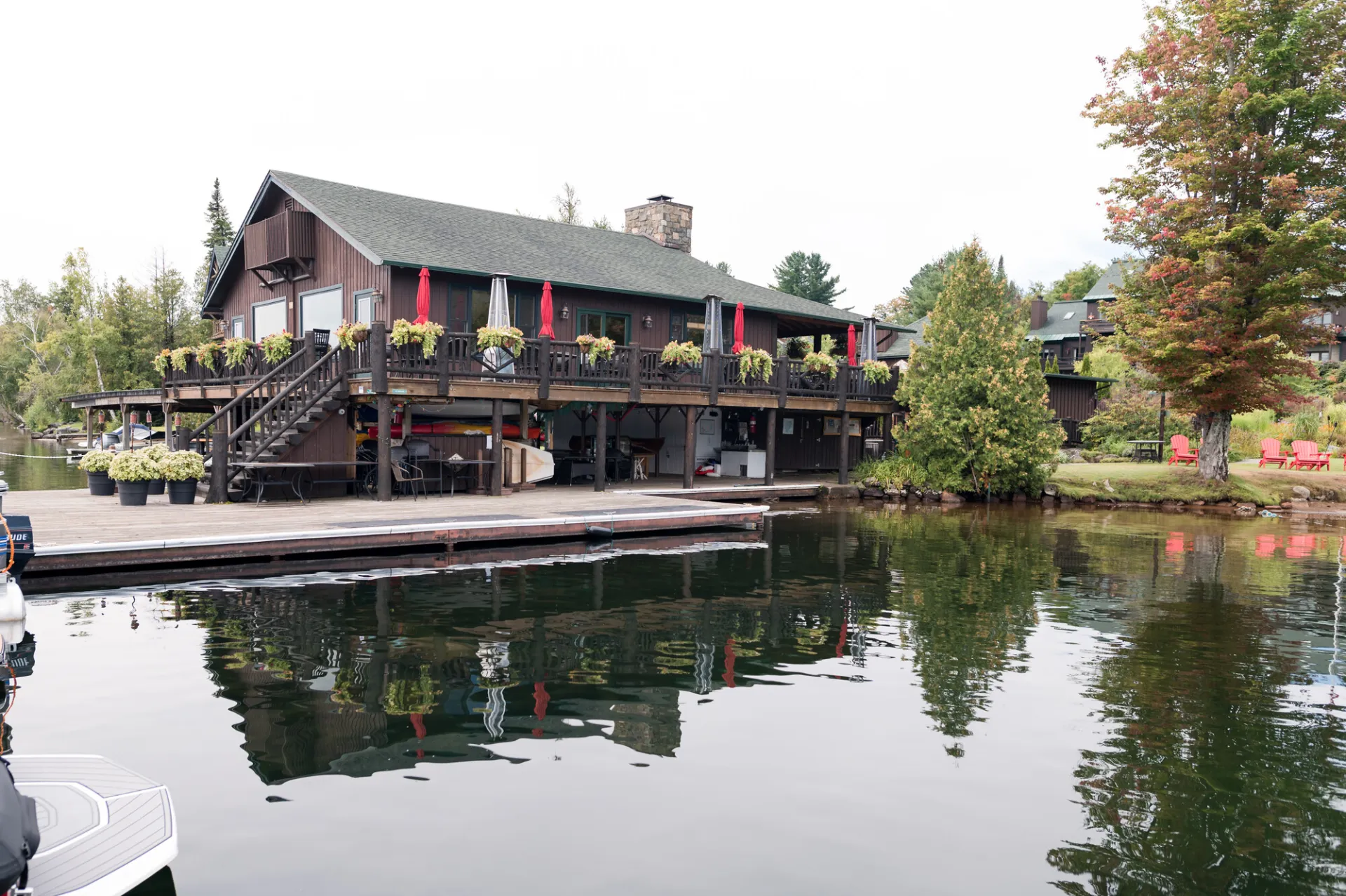 Moose Lodge Boathouse on the water of Lake Placid with flowerboxes