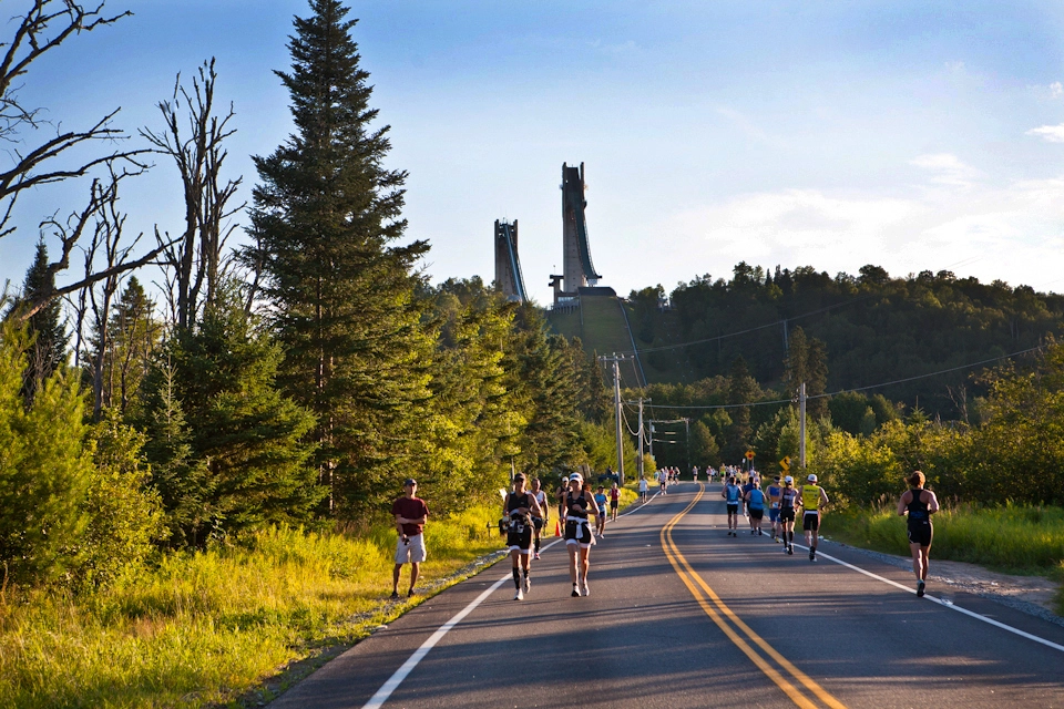 Runners heading out River Road in the 2013 Lake Placid Classic Half Marathon