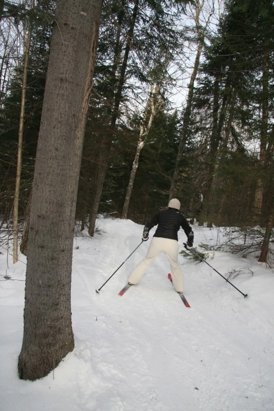 A skier heading downhill on the Jackrabbit Trail