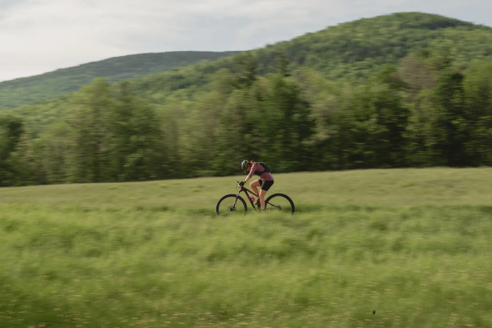 Bike racer crosses field
