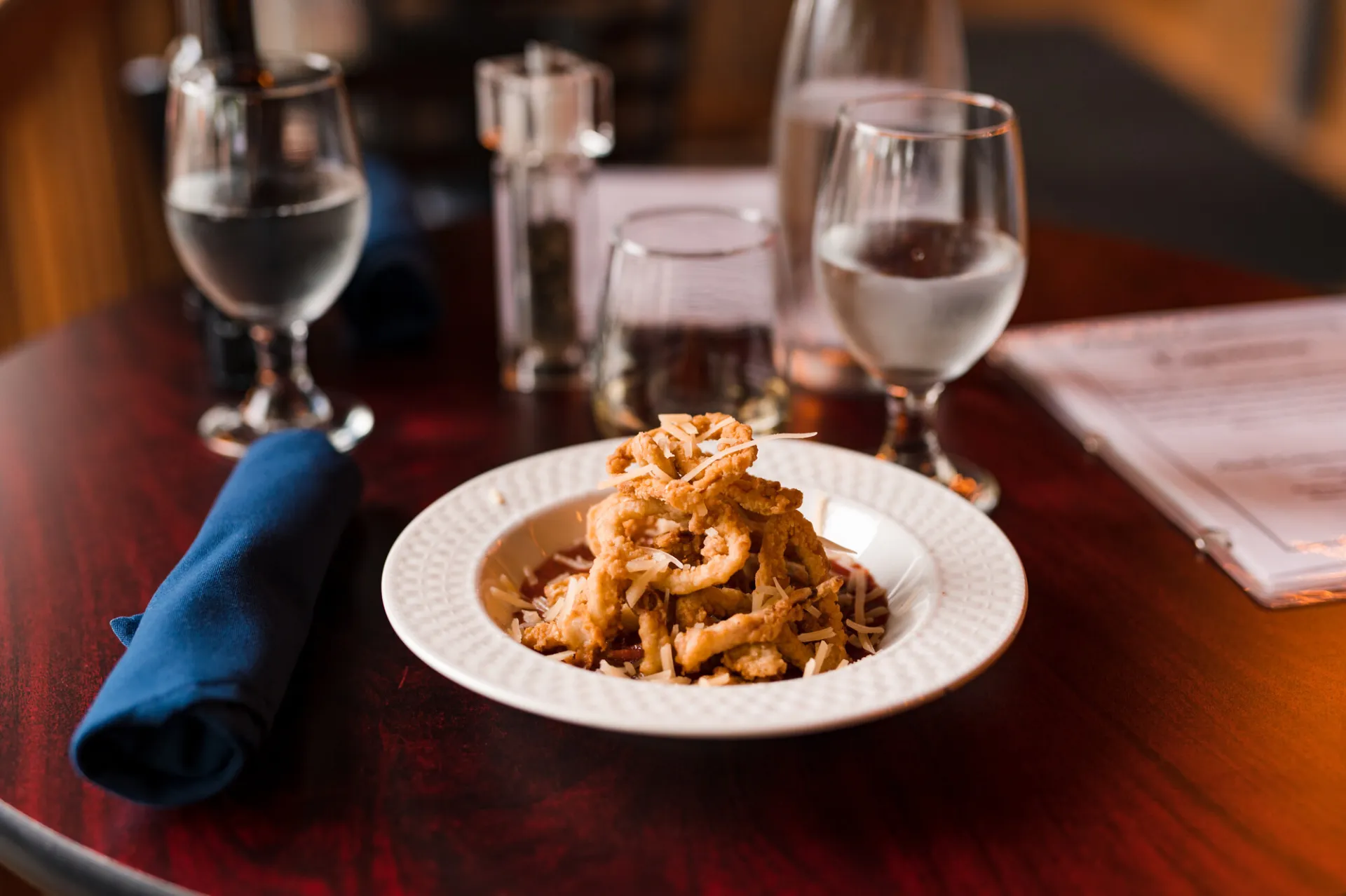 Plated food on a dining table from Amado restaurant.