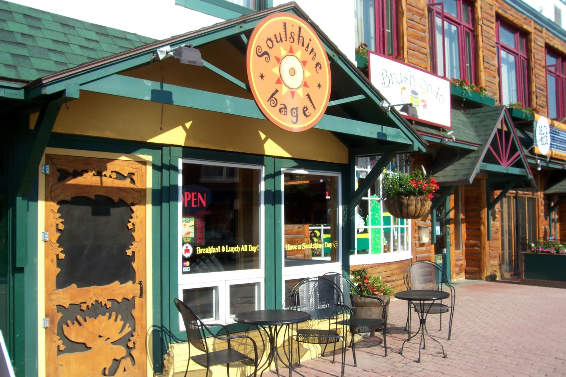 The front of a happy bagel shop named Soulshine Bagel.
