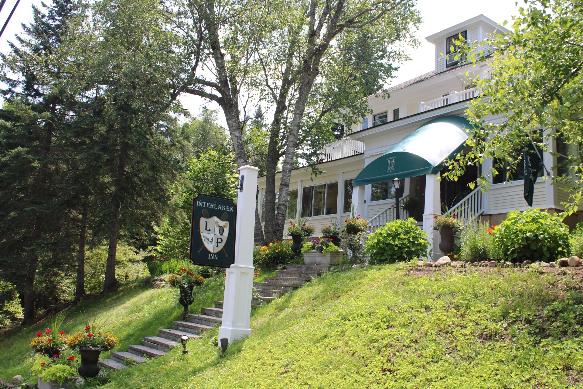 The front stairs and landscaped grounds leading up to the Interlaken Inn.