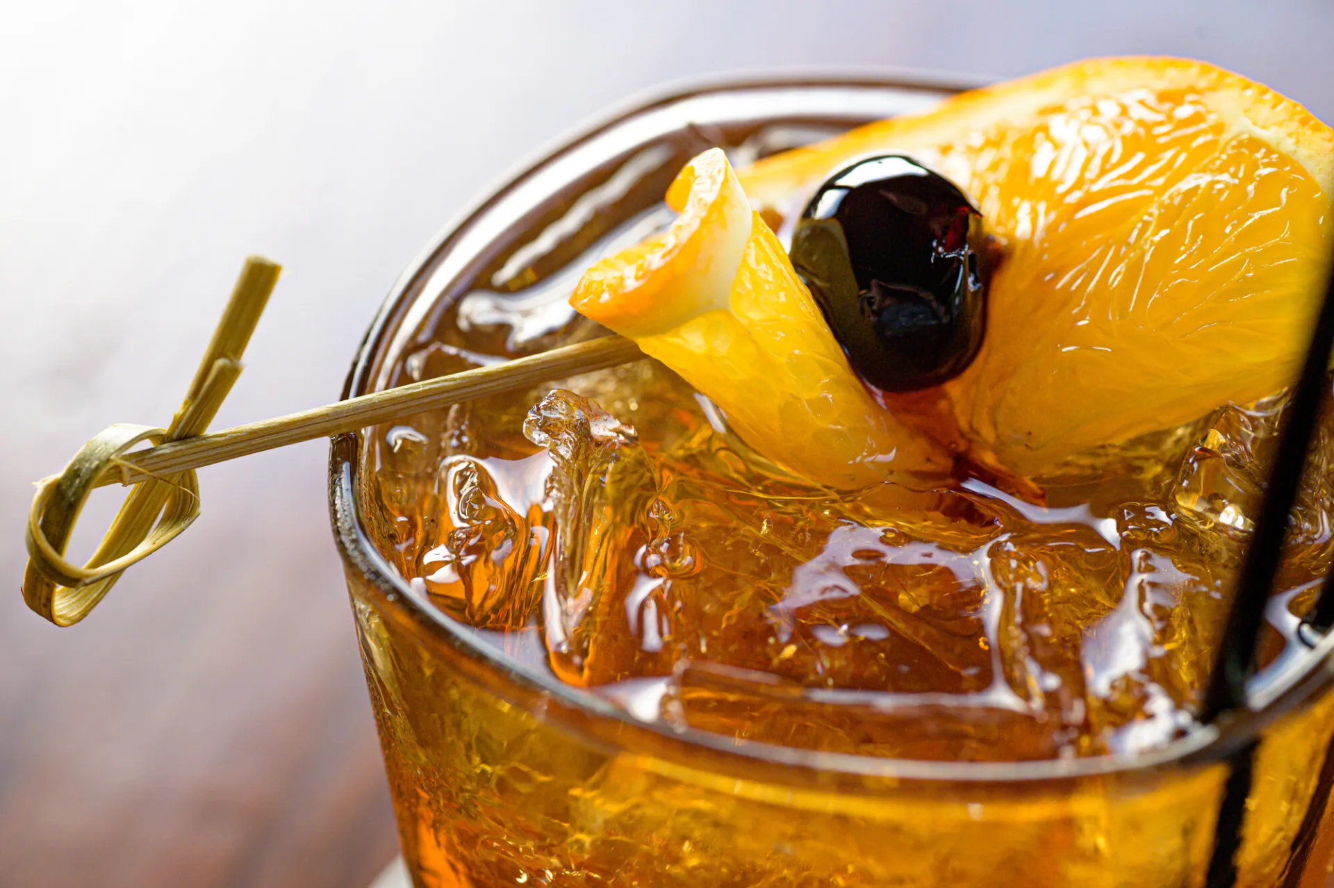 Cocktail with orange and luxardo cherry