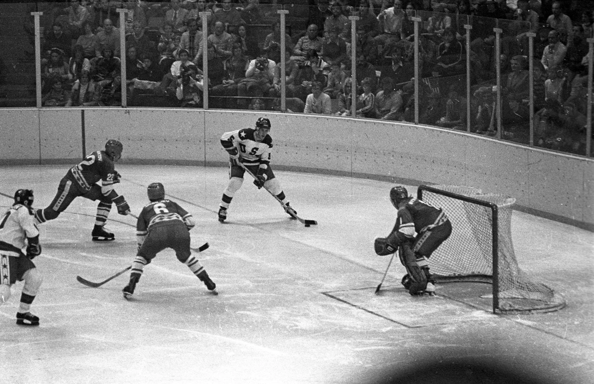 A black and white photo of a hockey game in 1980 at the Olympic Winter Games in Lake Placid.