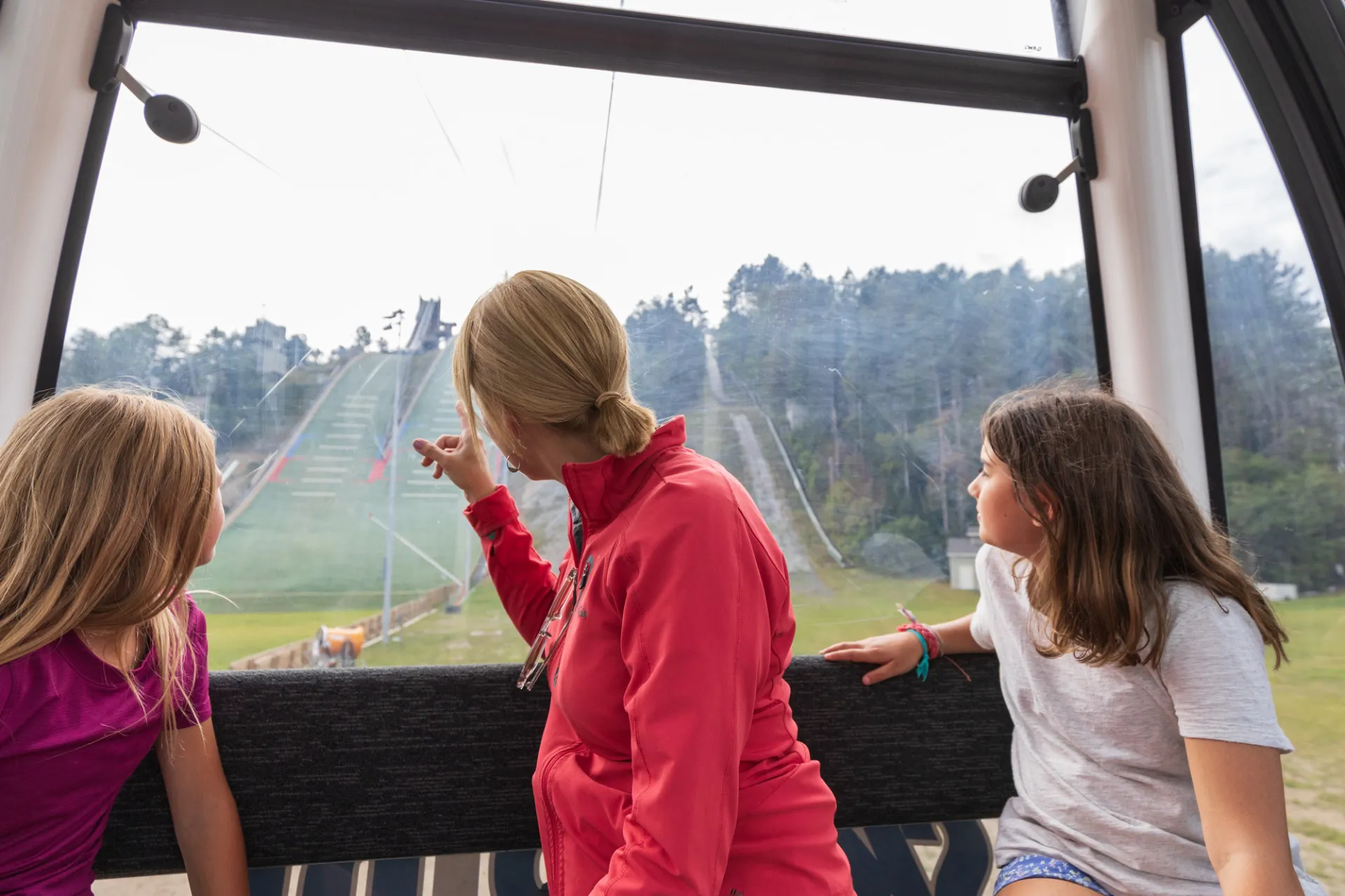 People enjoying the Skyride gondola in summer