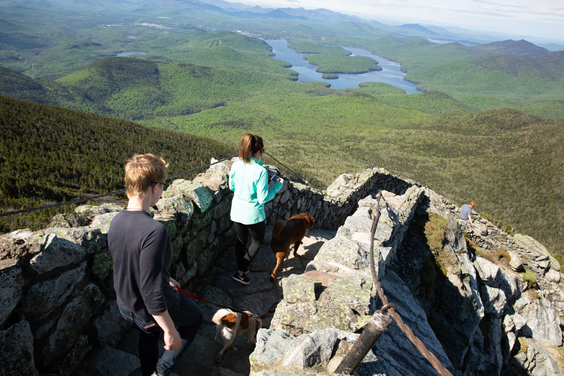 People hike the stone staircase at the top of Whiteface Mountain.