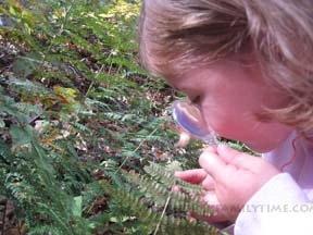 Girl with magnifying glass