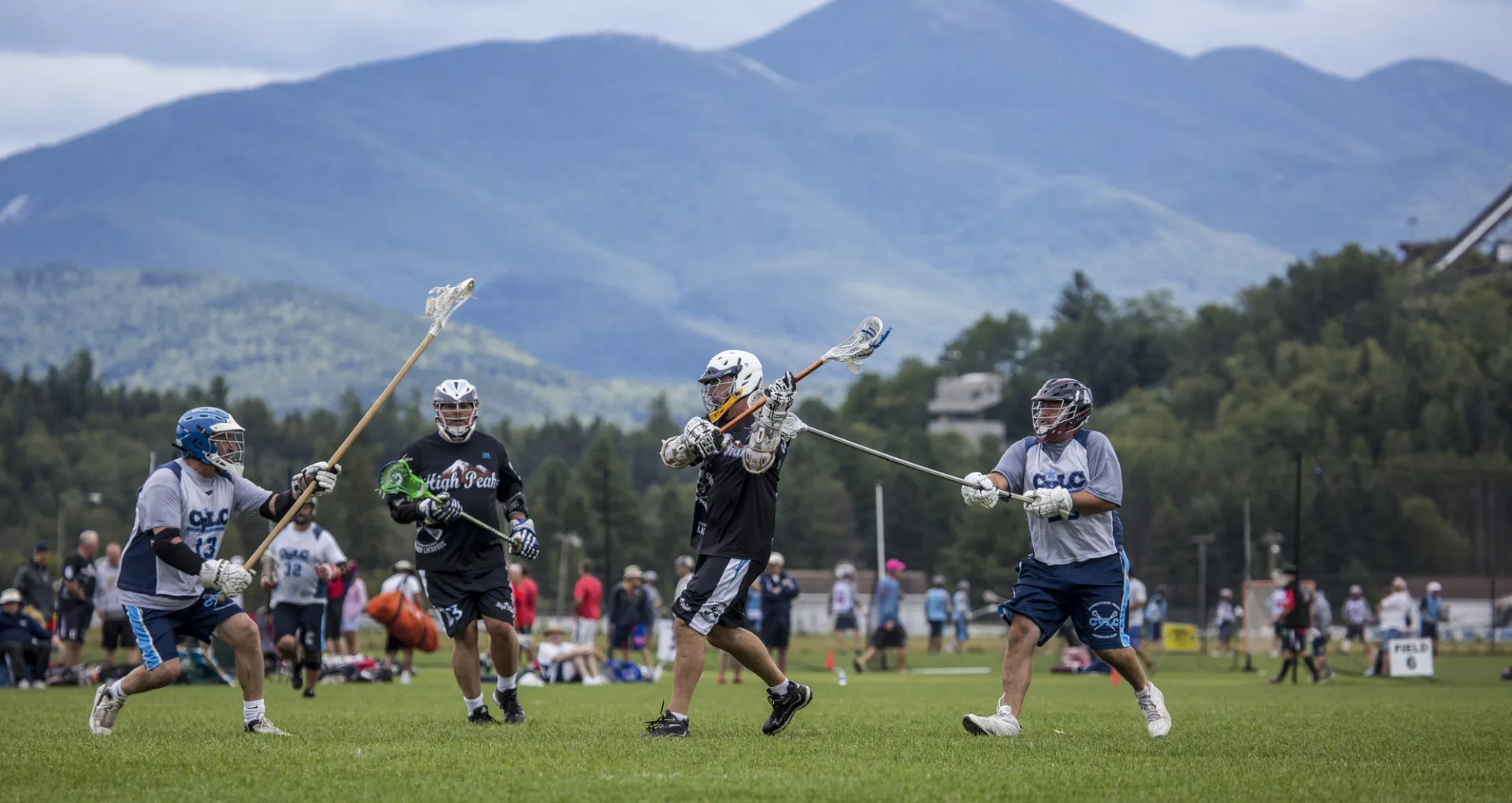 Men playing lacrosse on the tournament fields at the Horse Show Grounds in Lake Placid.