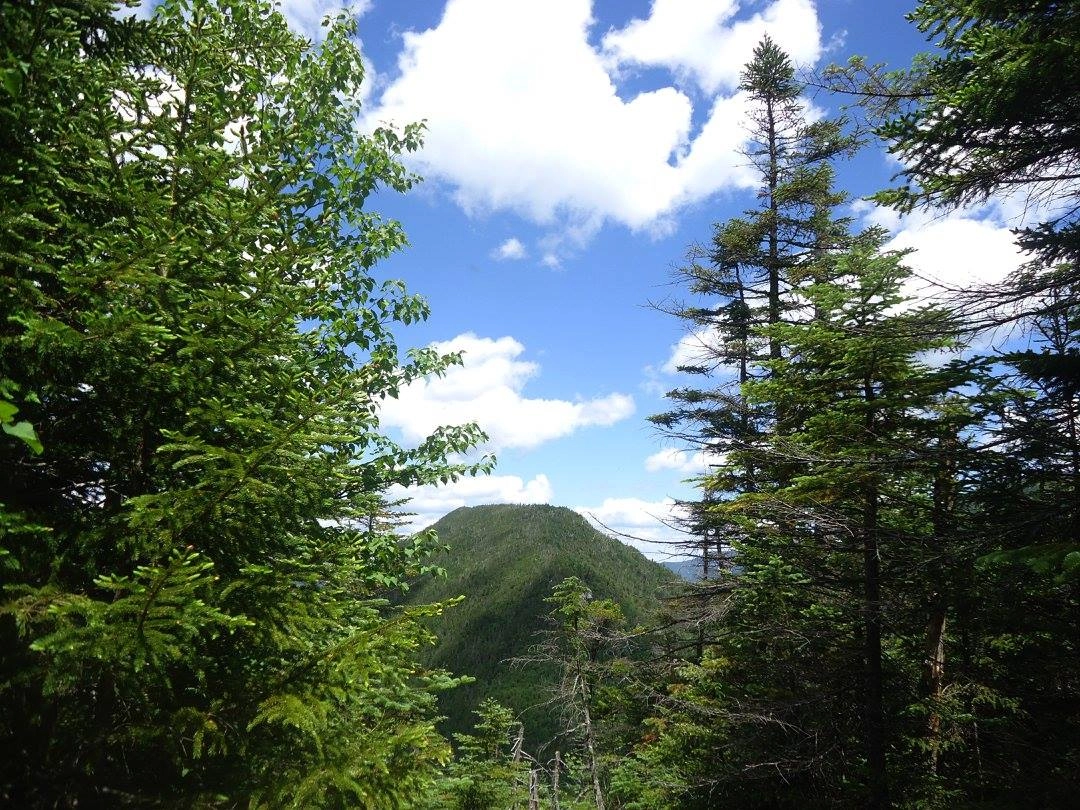 A narrow view of a flat-topped mountain
