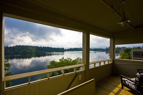 A view of the water from a covered porch