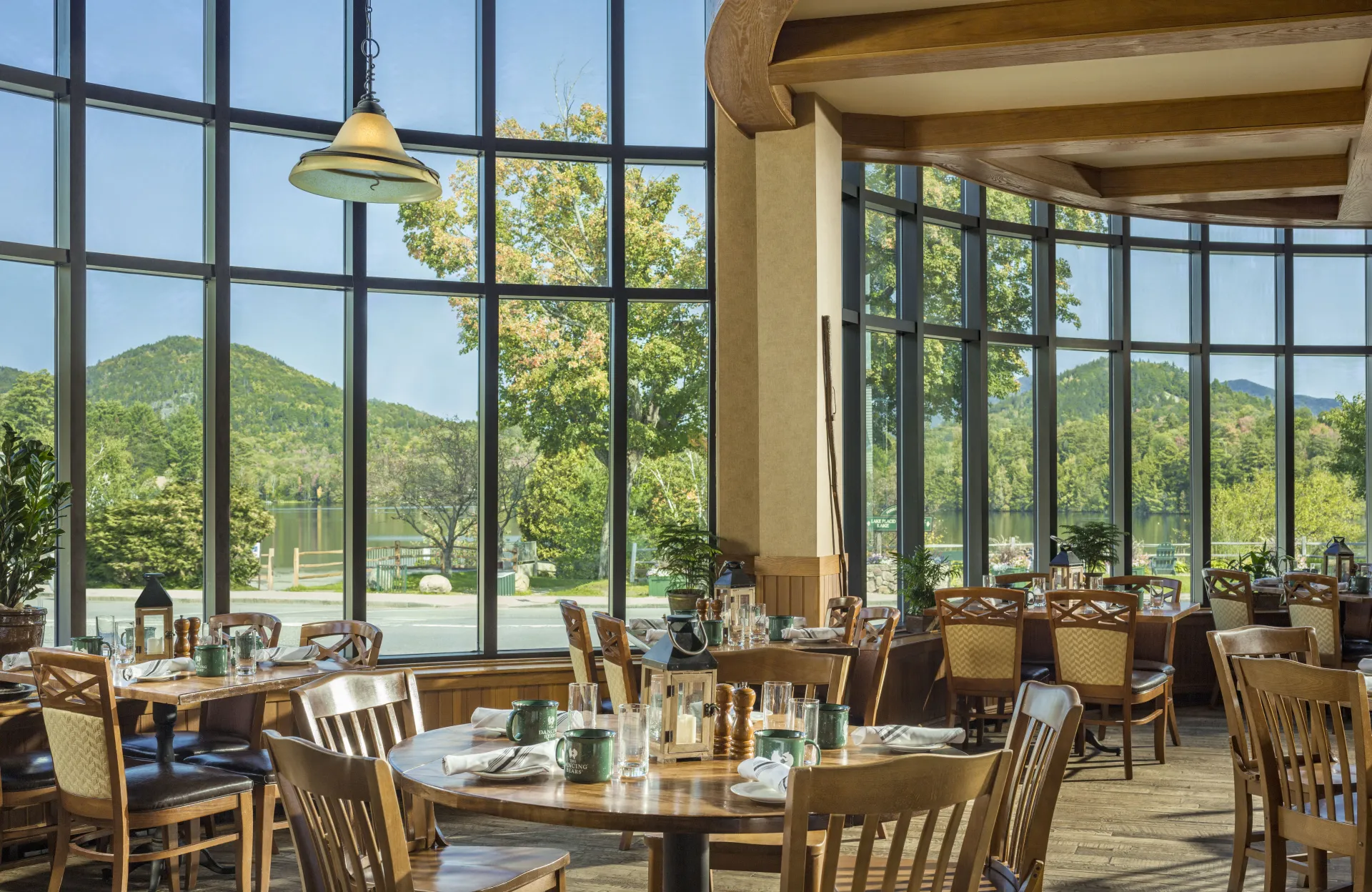 Dining area in Dancing Bears with large glass windows and table set for service