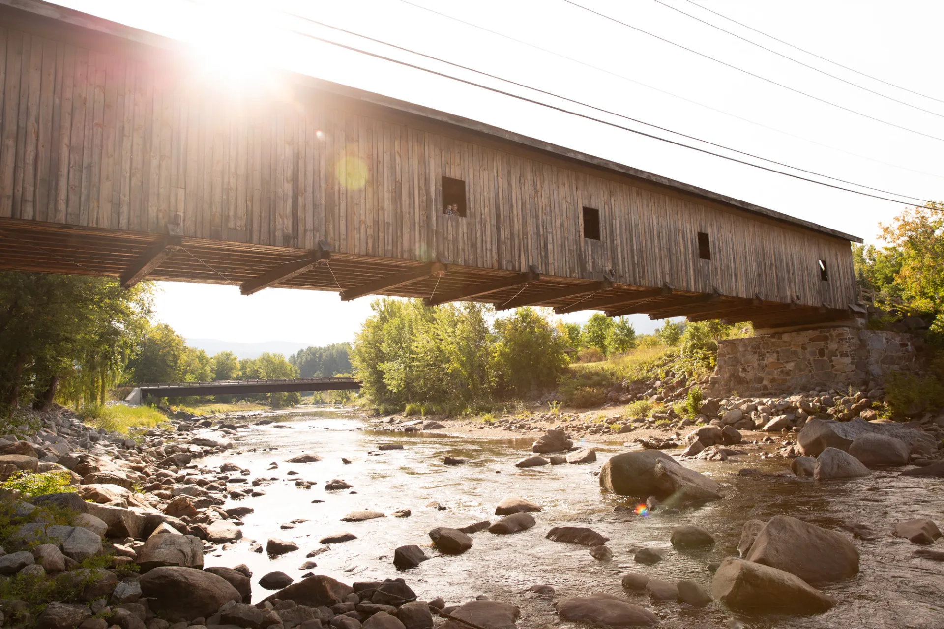 A covered bridge in bright sunlight