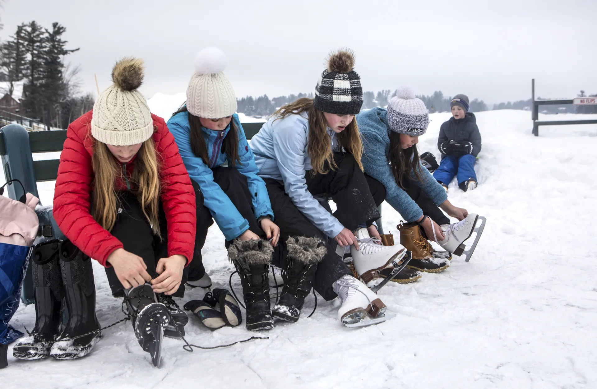 Putting skates on by Mirror Lake